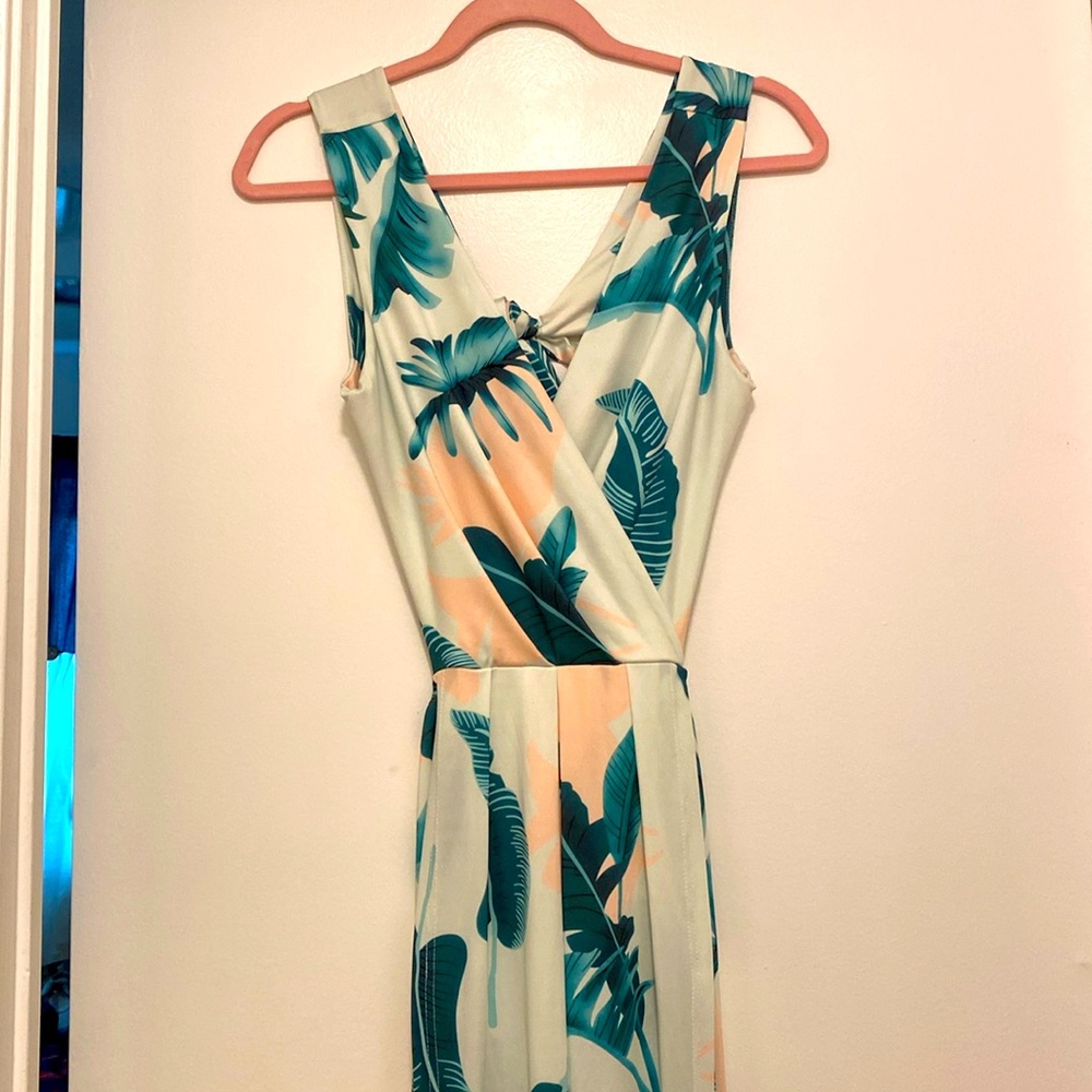 Tropical wrap style maxi dress with double front slits & open tie back.